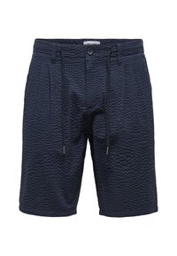 Shorts bleu marine en tissu texturé avec un motif géométrique, dotés d'une taille élastique et de cordons de serrage pour un ajustement adaptable.