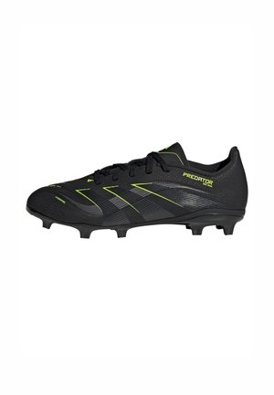 Black Adidas Predator soccer cleat with yellow accents and molded studs on a white background.