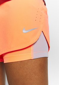 Nike Performance Träningsshorts - coral