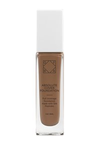 Fondotinta liquido marrone in una bottiglia di vetro trasparente con un tappo quadrato bianco. L'etichetta riporta "Fondotinta Absolute Cover" con dettagli in testo nero.