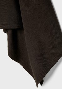 Dark brown knitted fabric folded, showing fine ribbed texture and doubled layered edges against a light background.