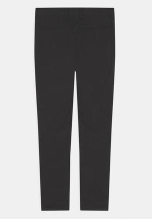 Black slim-fit dress pants with back welt pockets and belt loops, laid flat on a white background.