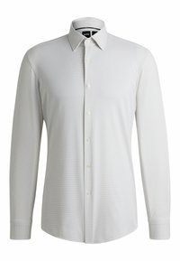 Witte langekleding shirt met een gestructureerd patroon, button-down kraag en een voorste placket met witte knopen. Getailleerde pasvorm en cuffs.