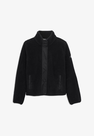 Veste en polaire noire avec une texture douce, un col haut et un panneau lisse contrastant au milieu. Comprend des poches latérales.