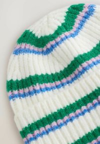 Knit beanie in white, featuring green, blue, and pink stripes. Soft, textured fabric with ribbed design and scalloped pattern at the top.