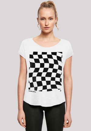 White T-shirt with a checkered pattern in black. Loose fit, wide neckline, short sleeves, and a curved hemline. Text "FANTASTIC" near the bottom.