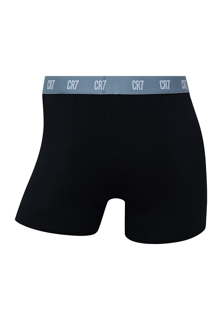 Boxer shorts de algodón negros con una cinturilla elástica gris claro que presenta el logotipo "CR7" en texto repetido. Textura suave, diseño ajustado.