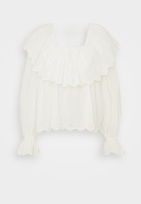 Blusa branca com decote franzido, mangas bufantes e bainha recortada. Feita de algodão bordado com detalhes de ilhós. Amarração nas costas.