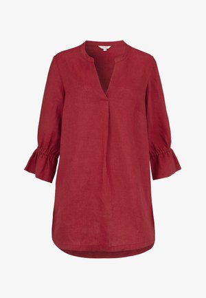 Czerwona bluzka z długim rękawem, z rozciętym dekoltem i marszczonymi mankietami, wykonana z lekkiego materiału, luźnego kroju, z okrągłym dołem.