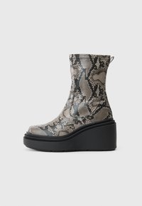 High-heeled ankle boots in a snakeskin pattern, featuring gray and black tones, with a chunky black platform and textured upper.