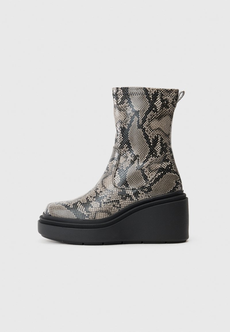 High-heeled ankle boots in a snakeskin pattern, featuring gray and black tones, with a chunky black platform and textured upper.
