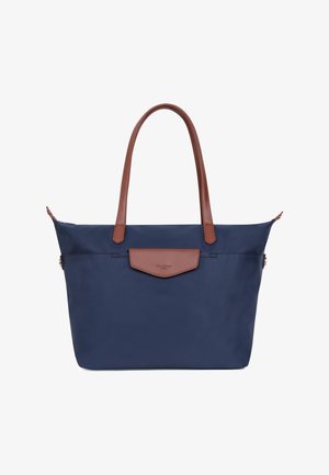 Marineblauwe draagtas met bruine leren handvatten en een klein voorvak met klep, minimalistisch ontwerp, gestructureerde vorm.