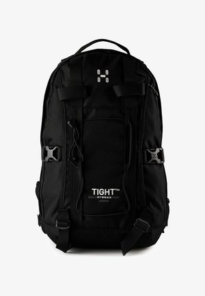 Sac à dos noir de taille moyenne avec boucles frontales, poignée supérieure et branding "TIGHT PRO" sur la poche avant.