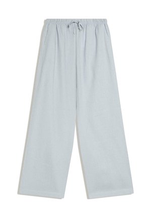 Pantalon bleu clair à jambes larges avec taille élastique et cordon, comprenant des poches latérales et une coupe ample et décontractée.