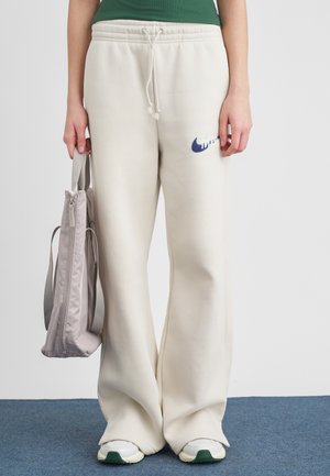 LOGO - Pantalones deportivos - beige