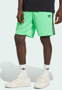 adidas Originals FIREBIRD - Tracksuit bottoms - screaming green   black