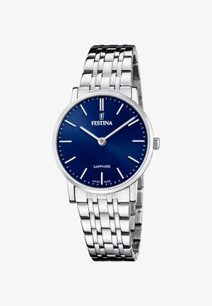 Reloj de acero inoxidable plateado con una esfera azul, cristal de zafiro y marcadores de hora plateados. Cuenta con una pulsera de eslabones de metal y una caja redonda.