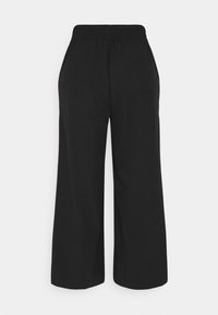 Black wide-leg trousers with an elastic waistband, made from a smooth fabric, featuring no pockets or embellishments.