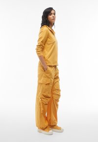 Freddy MELANIE CARGO - Bukse - golden apricot direct dyed