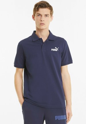Polo shirt blu navy realizzato in tessuto liscio, con colletto e maniche corte, e logo Puma bianco sul petto.