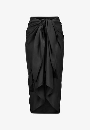 Schwarzer Midirock mit Knoten vorne, drapiertem Stoff und Quastendetails an den Enden der Schnürung.