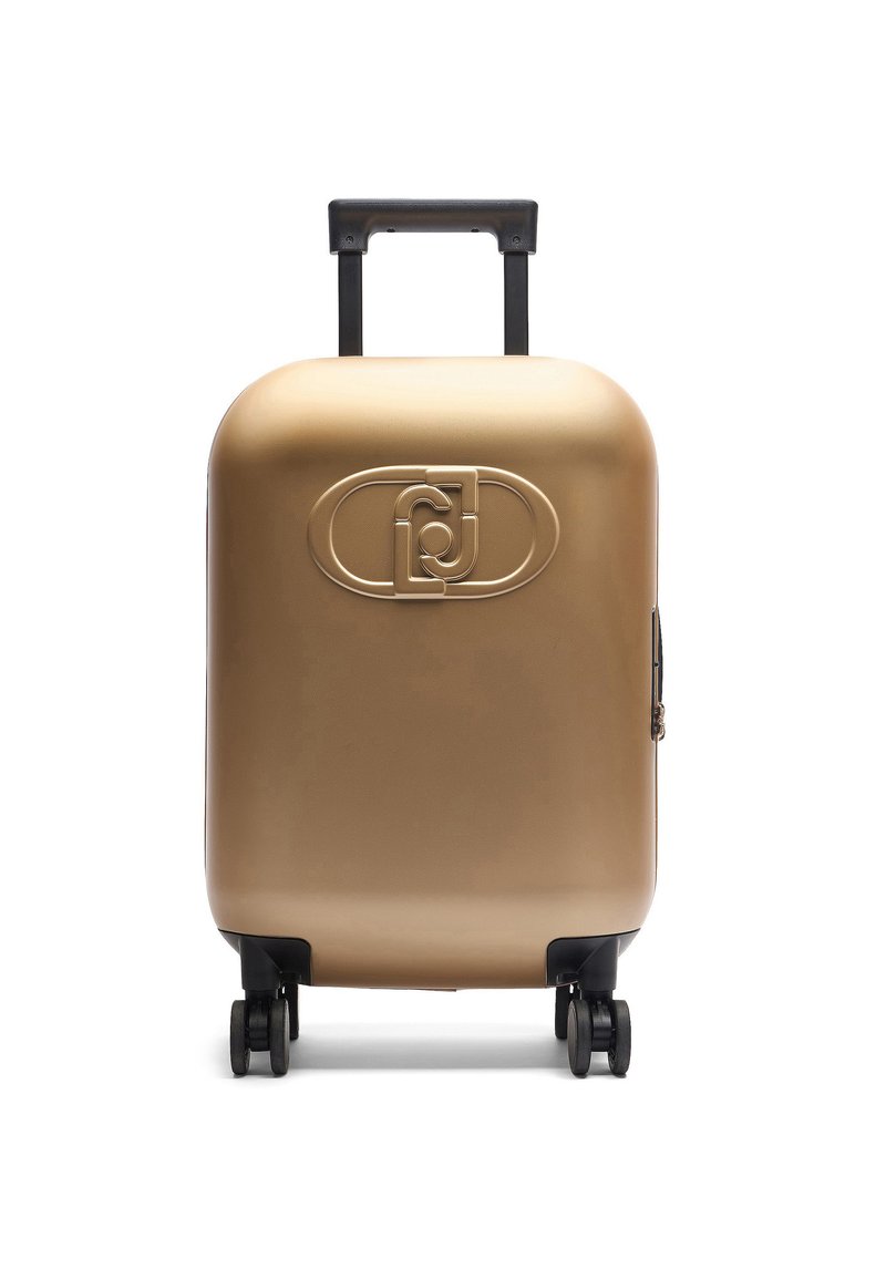 Valise rigide en or métallisé, dotée d'une surface lisse, d'un logo sculpté à l'avant, d'une poignée noire rétractable et de quatre roues noires.