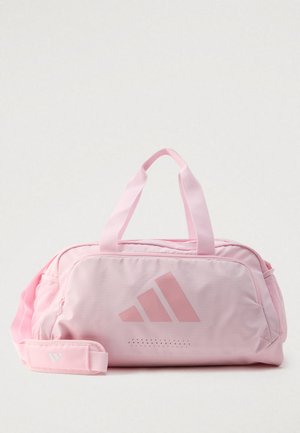 Bolsa de lona rosa de nailon con asas dobles, correa de hombro ajustable y un gran logo. Cuenta con cierre de cremallera y bolsillo lateral de malla.
