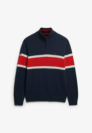 Marineblå zip-neck sweater lavet af strikket materiale, med røde og hvide vandrette striber på tværs af brystet, struktureret ribbet krave og manchetter.