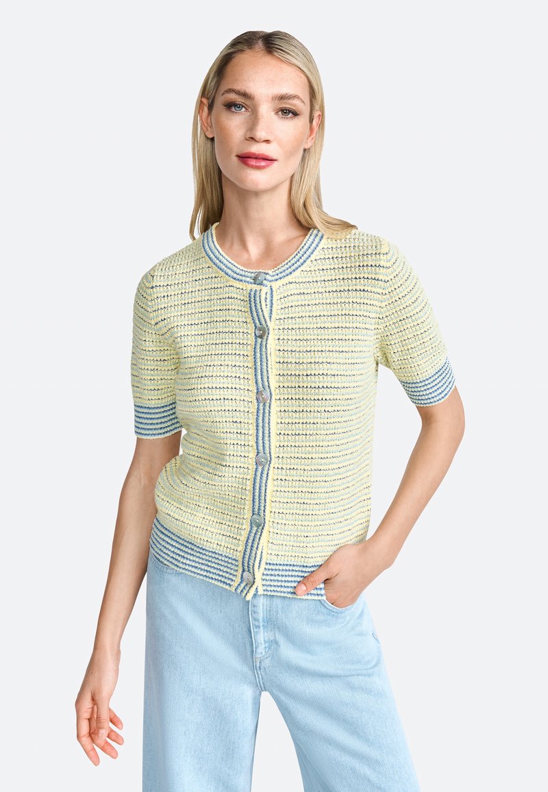 Knitted short-sleeve cardigan in pale yellow with blue stripes. Features a round neckline and button closure at the front. Lightweight texture.