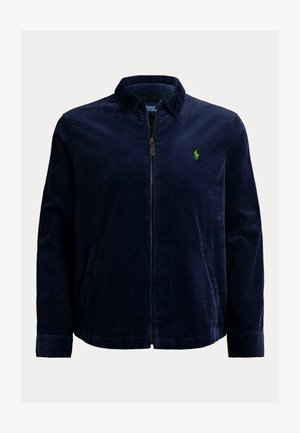 Casaco de veludo cotelê azul-marinho para homem, com fecho de correr completo, dois bolsos frontais, gola e pequeno logótipo bordado verde no lado esquerdo do peito.