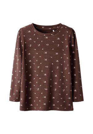 Chemise à manches longues côtelée marron avec de petits motifs floraux roses, col rond et coupe décontractée. Texture douce, idéale pour une tenue décontractée.