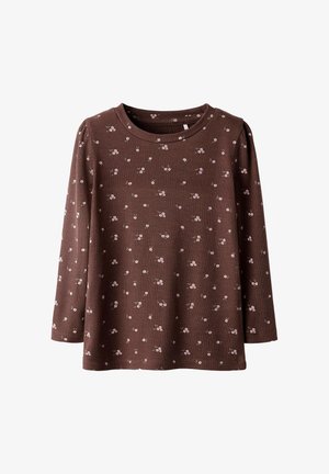 Bruine geribde langemouwen shirt met kleine roze bloemenpatronen, ronde halslijn en een ruime pasvorm. Zachte textuur, geschikt voor casual kleding.