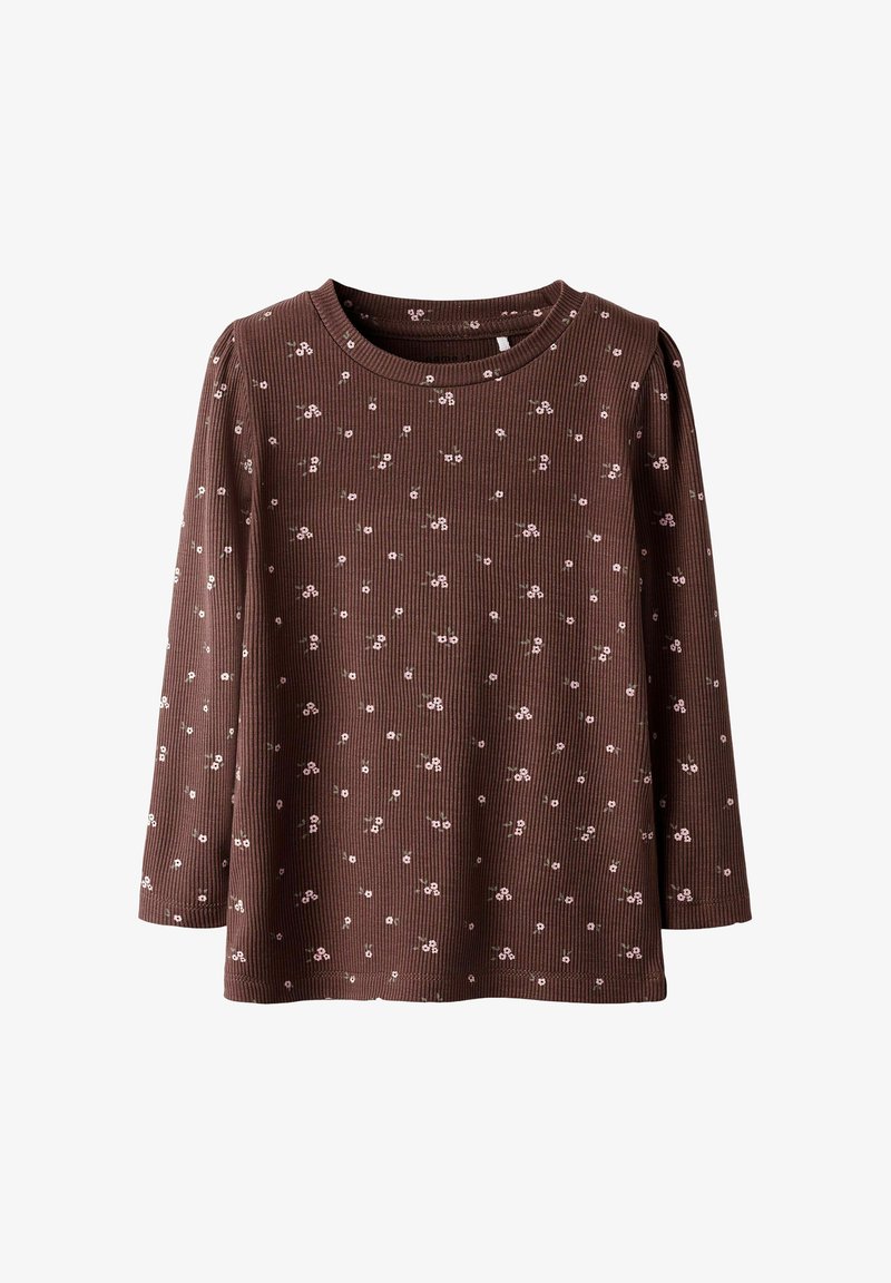 Maglietta a maniche lunghe marrone a coste con piccoli motivi floreali rosa, scollatura rotonda e taglio rilassato. Tessuto morbido, adatta per un look informale.