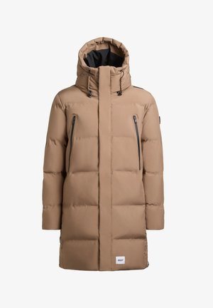 Beige puffer jacket with a high collar and detachable hood. Features black zippered pockets and a logo patch at the hem. Smooth, quilted texture.