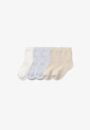 Five pairs of plain toddler socks in white, light gray, and beige, arranged side by side on a white background.