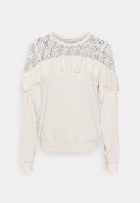 Krémový svetr s dlouhými rukávy, krajkovou yoke a volánkovým detailem přes hruď a ramena, přízovou manžetou a lemem.