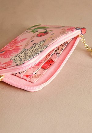 Multicolor zippered wallet made of fabric. Features floral patterns in pink, green, and red on an inner lining with a chain accent.
