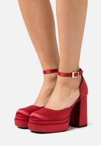 Buffalo MAY DORSAY - Saltos plataforma - red