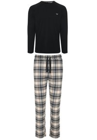 Chemise noire à manches longues avec un col en V et des manches raglan, associée à un pantalon à carreaux en crème, noir et marine, doté d'une taille élastique.