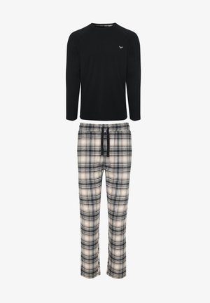 Chemise noire à manches longues avec un col en V et des manches raglan, associée à un pantalon à carreaux en crème, noir et marine, doté d'une taille élastique.