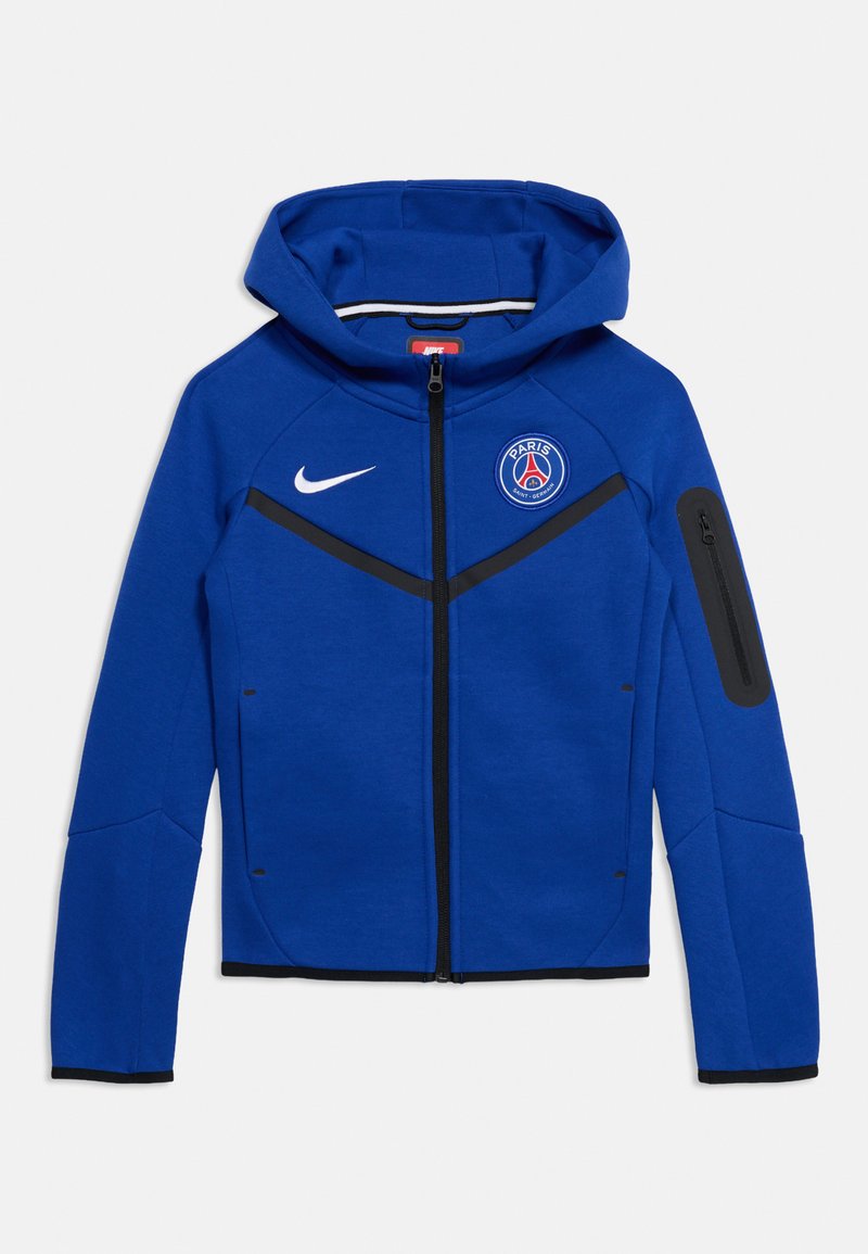 Μπλε φούτερ Nike με φερμουάρ, με λογότυπο της Paris Saint-Germain στο στήθος, μαύρο φερμουάρ και τσέπη με φερμουάρ στο αριστερό μανίκι.