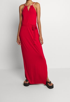 Red maxi dress with spaghetti straps and a keyhole neckline. Features a fitted waist and a tie belt. Smooth fabric with a flowy silhouette.