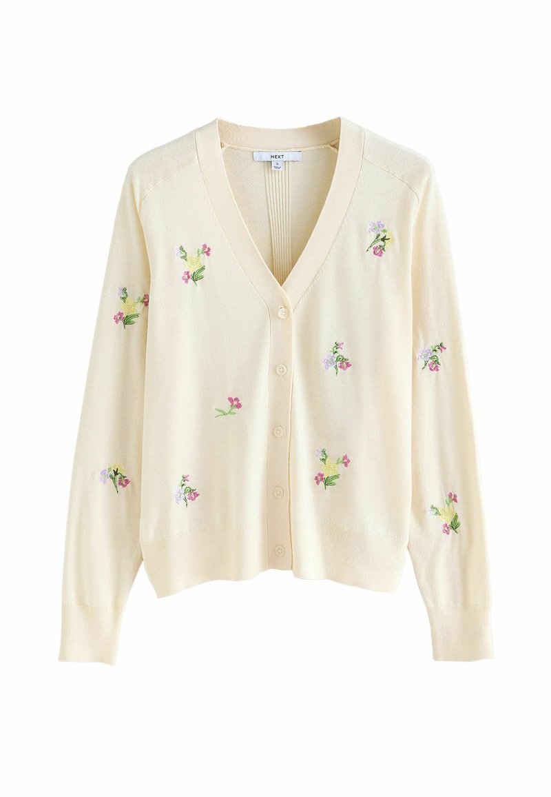 Krémový cardigan s designem v-neck, se zdobením květinové výšivky v růžové a zelené barvě, a pěti knoflíky vpředu. Hladká textura.