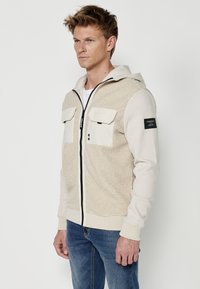 Koroshi Jachetă din fleece - beige
