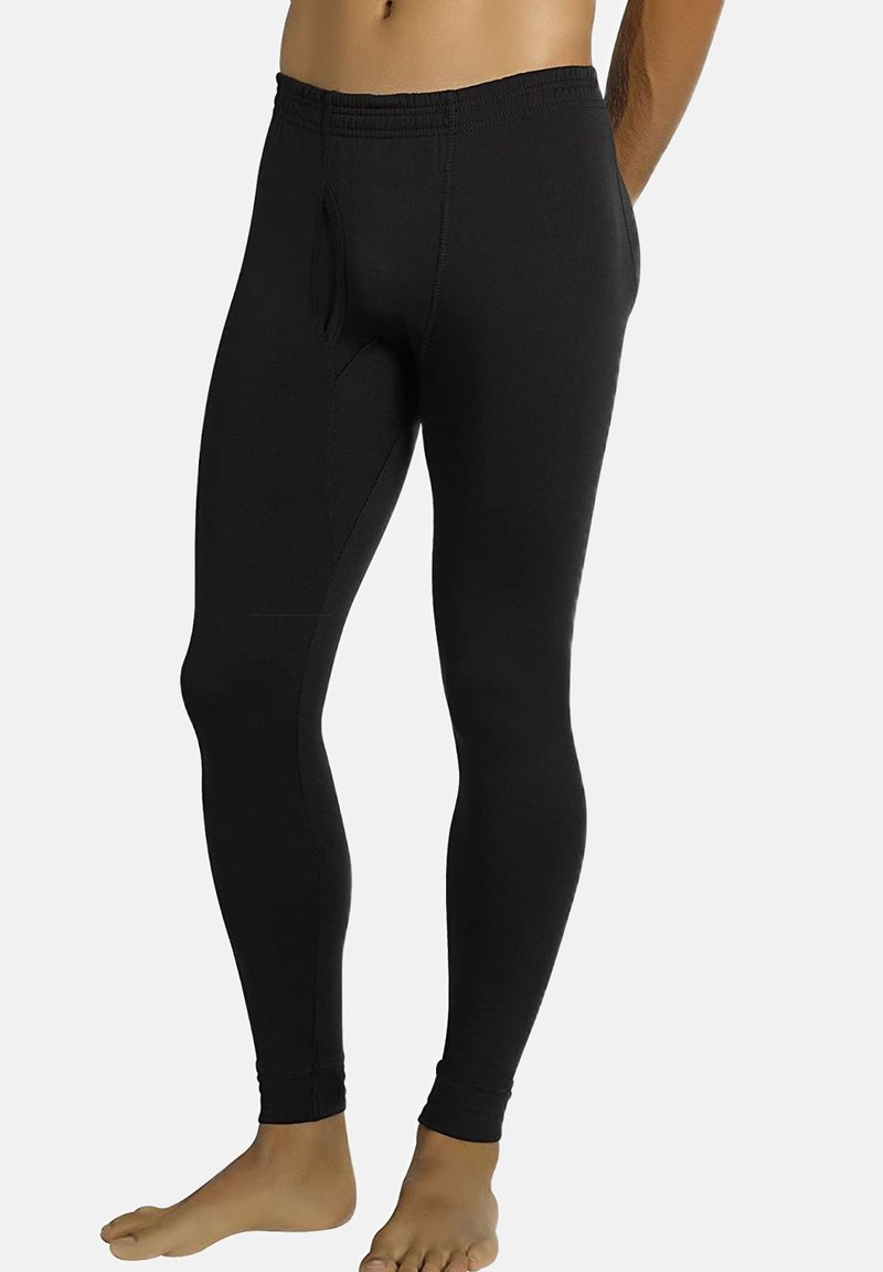 Leggings negros hechos de tela elástica, con una cinturilla elástica, forma ajustada y un detalle de bolsillo frontal para mayor funcionalidad.