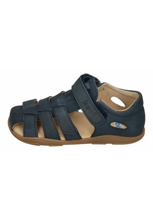 Navy blue closed-toe sandal with adjustable straps, cushioned beige interior, and flexible brown sole designed for comfort and secure fit.
