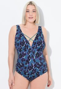Maillot de bain une pièce à imprimé léopard multicolore, avec un décolleté en V profond et des bretelles croisées en bleu aqua. Fabriqué en tissu lisse et extensible.