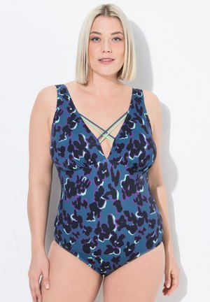 Maillot de bain une pièce à imprimé léopard multicolore, avec un décolleté en V profond et des bretelles croisées en bleu aqua. Fabriqué en tissu lisse et extensible.