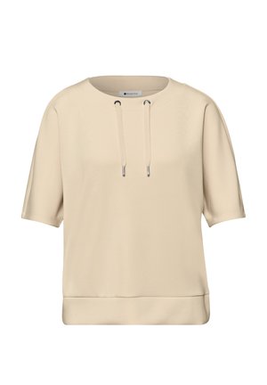 Sudadera beige de manga corta con escote redondo y detalles de cordones en la parte delantera, hecha de tela suave.