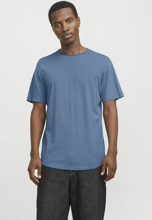 Blue short-sleeve T-shirt made of lightweight fabric, featuring a round neckline and a relaxed fit. Textured surface with subtle variations.